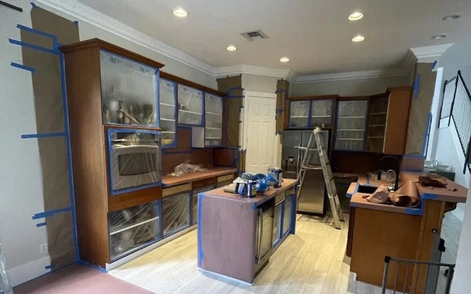 Kitchen cabinet refinishing in progress by Frontline Painting